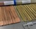 Full size flux coated nickel bronze TIG/OXY rods laid out for industrial quality inspection